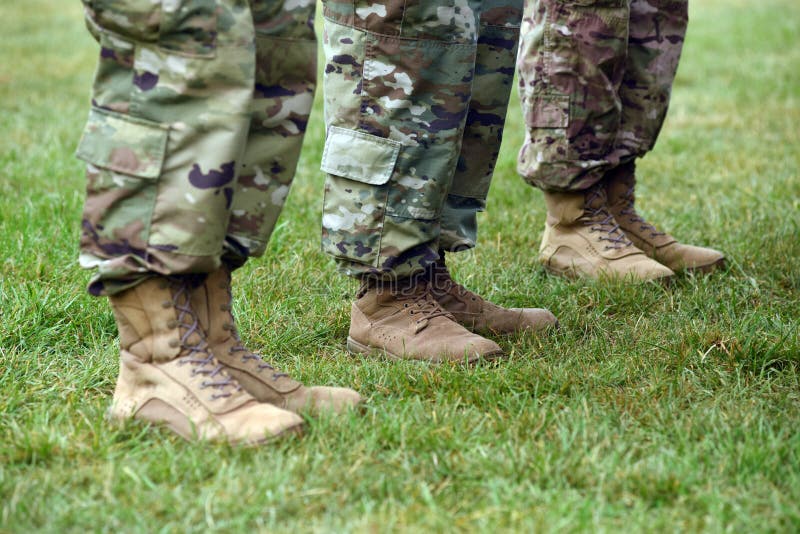 US soldiers legs in green camouflage military uniform. US troops. US soldiers legs in green camouflage military uniform. US troops.