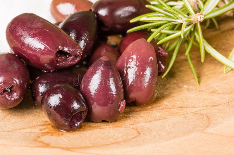 Kalamata olives with rosemary and salt ready to prepare. Kalamata olives with rosemary and salt ready to prepare