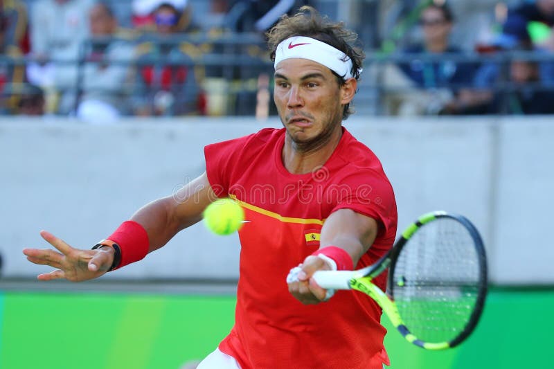Олимпийский чемпион Рафаэль Nadal Испании в действии во время ` s людей определяет полуфинал Рио 2016 Олимпийских Игр стоковое изображение Олимпийский чемпион Рафаэль Nadal Испании в действии во время ` s людей определяет полуфинал Рио 2016 Олимпийских Игр стоковое изображение