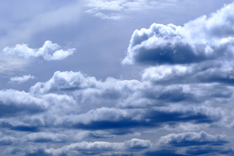 High quality photo of gorgeous deep dark gray with blue sky full of different cumulus or rain clouds. High-contrast colors, interesting composition, all clouds look quite fluffy and volumetric. Large image size makes the image good for printing. Fits for different purposes: environment, nature or ecological topics, for design, etc. High quality photo of gorgeous deep dark gray with blue sky full of different cumulus or rain clouds. High-contrast colors, interesting composition, all clouds look quite fluffy and volumetric. Large image size makes the image good for printing. Fits for different purposes: environment, nature or ecological topics, for design, etc.