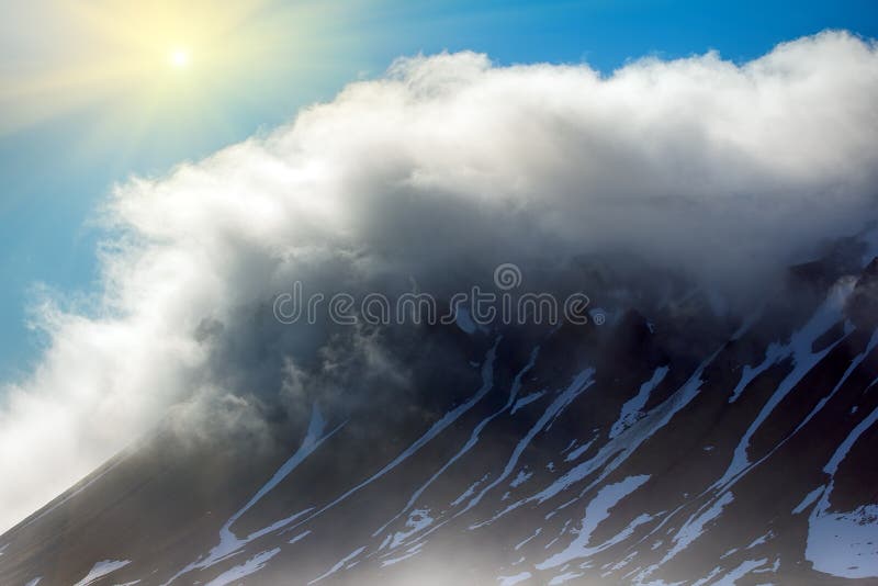 Gloomy Cover glacier in Arctic Franz-Josef Land . Cloud caught on the glacial sheet, nunatak in fog. Gloomy Cover glacier in Arctic Franz-Josef Land . Cloud caught on the glacial sheet, nunatak in fog