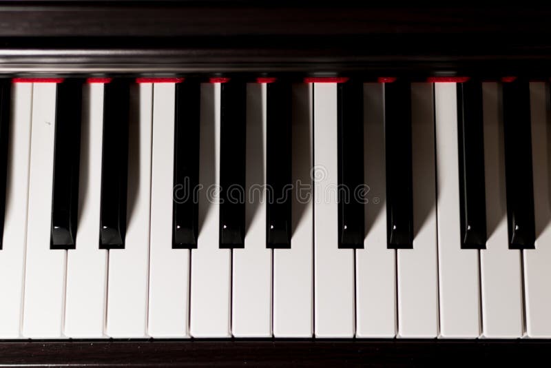 Lightened classic piano keys photographed from above. Lightened classic piano keys photographed from above