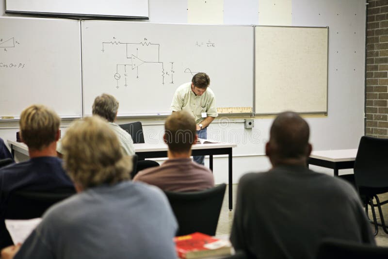 An adult education class in electricity. Focus on the electrical circuit diagram on the board. FILE ID: 2721619. An adult education class in electricity. Focus on the electrical circuit diagram on the board. FILE ID: 2721619