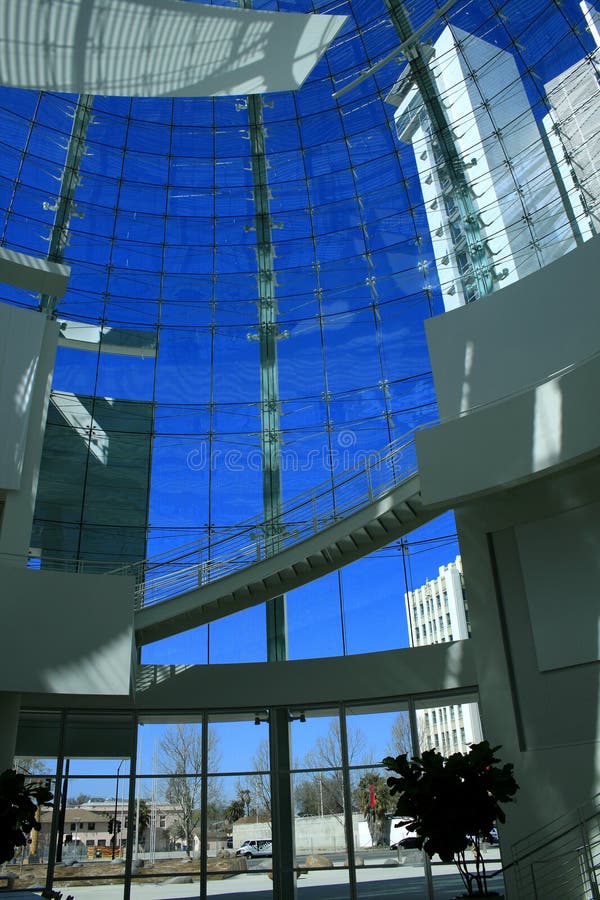 Sunny day. Blue sky through modern window wall. Sunny day. Blue sky through modern window wall.