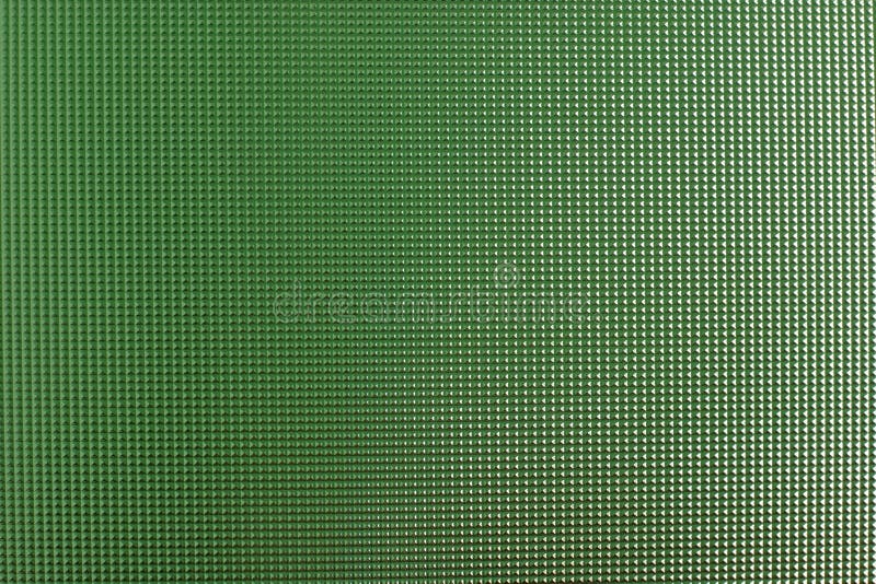 Green textured window glass close-up. Green textured window glass close-up