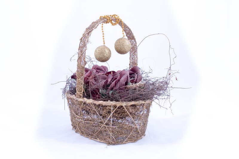 Wooden basket with ornaments hanging from handle. Wooden basket with ornaments hanging from handle