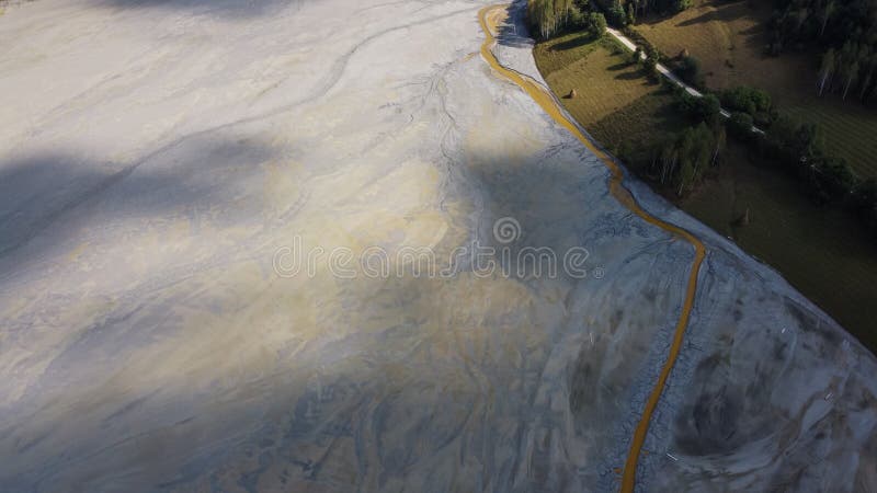 Aerial View Over a Big Waste Lake Polluted With Toxic Mining Residuals Tailings From an Open Pit Copper Mine in Geamana, Rosia Poieni, Romania. Aerial View Over a Big Waste Lake Polluted With Toxic Mining Residuals Tailings From an Open Pit Copper Mine in Geamana, Rosia Poieni, Romania