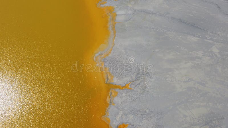 Aerial View Over a Big Waste Lake Polluted With Toxic Mining Residuals Tailings From an Open Pit Copper Mine in Geamana, Rosia Poieni, Romania. Aerial View Over a Big Waste Lake Polluted With Toxic Mining Residuals Tailings From an Open Pit Copper Mine in Geamana, Rosia Poieni, Romania