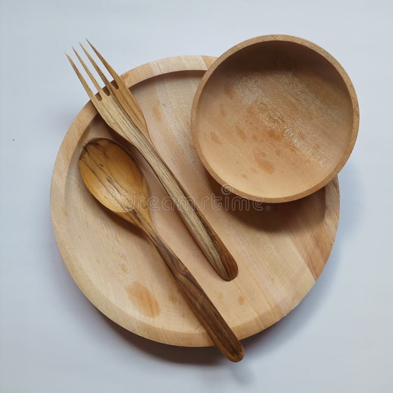 tableware made of wood in the form of plates, spoons, and forks that can be used every day. tableware made of wood in the form of plates, spoons, and forks that can be used every day