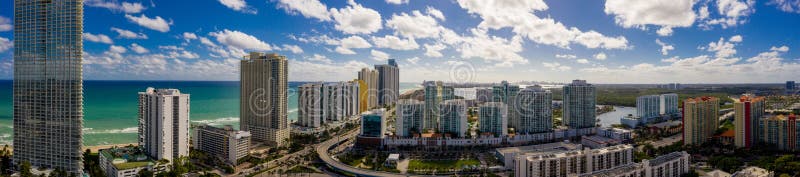 Aerial panorama Sunny Isles Beach facing south at 163rd Street highrise beachfront condominiums in photo USA. Aerial panorama Sunny Isles Beach facing south at 163rd Street highrise beachfront condominiums in photo USA