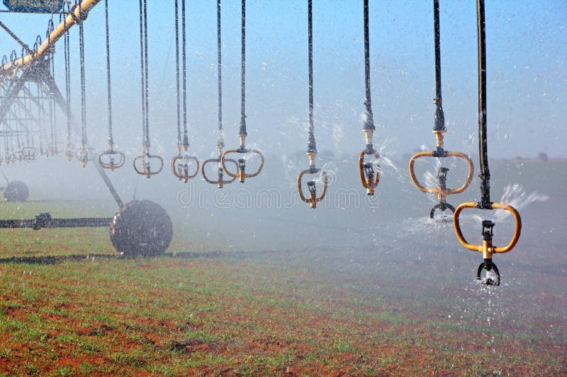 Center pivot crop irrigation system with water sprinklers. Center pivot crop irrigation system with water sprinklers