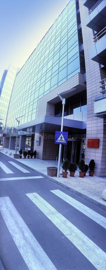 Panoramic view of an office building and pedestrian crossing (film scan, Horizon non standard panoramic ratio 2.4:1). Panoramic view of an office building and pedestrian crossing (film scan, Horizon non standard panoramic ratio 2.4:1)