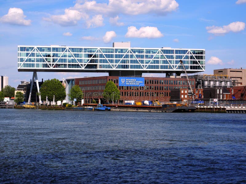 Rotterdam, Netherlands - June, 2, 2019: Headquarters of Unilever Bestfoods Nederland. The building is desgned by JHK architects and float above the historic factory of Blue Band. Rotterdam, Netherlands - June, 2, 2019: Headquarters of Unilever Bestfoods Nederland. The building is desgned by JHK architects and float above the historic factory of Blue Band