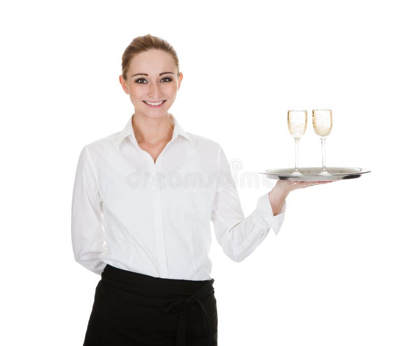 Young Waitress Carrying A Tray With Wine Glasses Over White Background. Young Waitress Carrying A Tray With Wine Glasses Over White Background