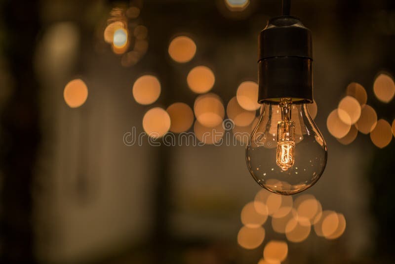 Lighting decor. Retro light bulb filament close up.Illuminated night. Lighting decor. Retro light bulb filament close up.Illuminated night