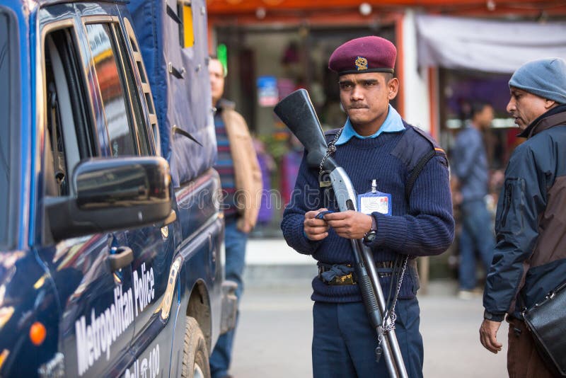 KATHMANDU, NEPAL - DEC 2, 2013: Polices during protest within a campaign to end violence against women (VAW). Held annually since 1991, 16 days from Nov 25 to Dec 10. KATHMANDU, NEPAL - DEC 2, 2013: Polices during protest within a campaign to end violence against women (VAW). Held annually since 1991, 16 days from Nov 25 to Dec 10.