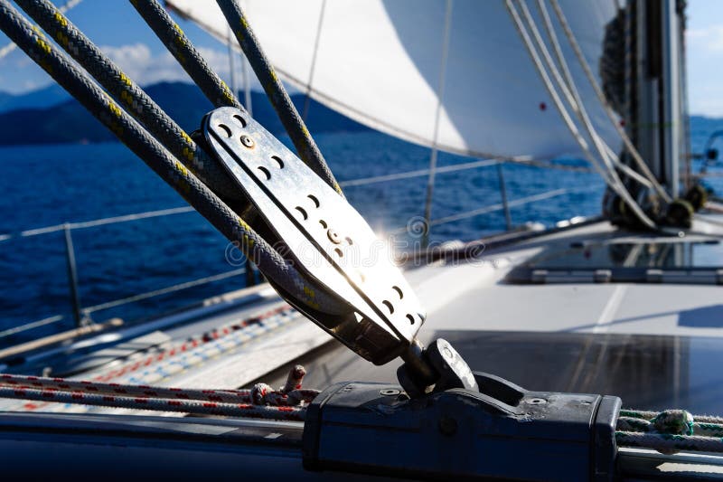 Sailing yacht rigging equipment with bright spot of light. Sailing yacht rigging equipment with bright spot of light.