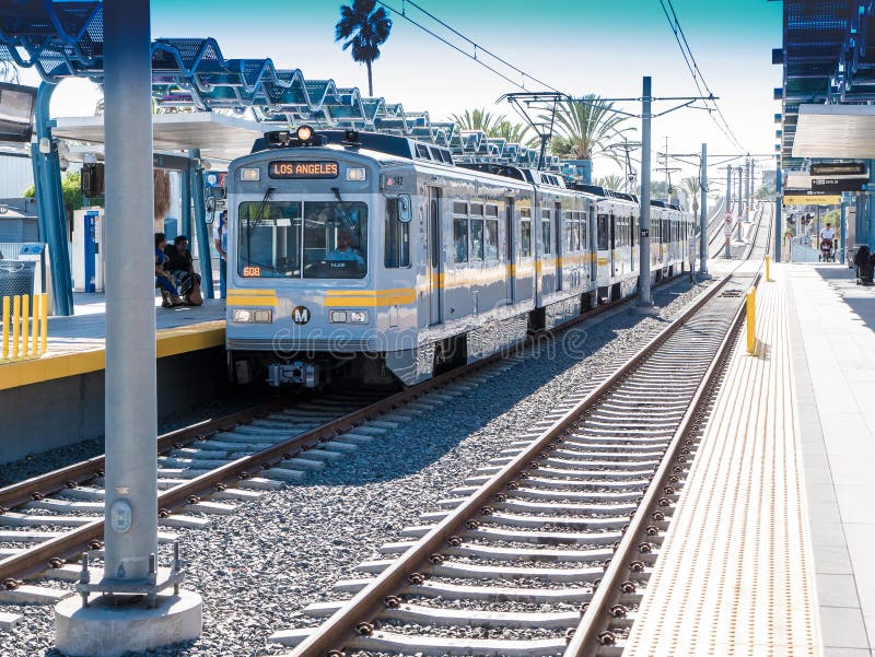 Metro Light Rail Platform Looking West At 26th St/Bergamot Station In Santa Monica, California. 26th Street/Bergamot is an at-grade light rail station in the Los Angeles County Metro Rail system. It is located near the intersection of 26th Street and Olympic Boulevard in Santa Monica, California. The station serves the Expo Line. Metro Light Rail Platform Looking West At 26th St/Bergamot Station In Santa Monica, California. 26th Street/Bergamot is an at-grade light rail station in the Los Angeles County Metro Rail system. It is located near the intersection of 26th Street and Olympic Boulevard in Santa Monica, California. The station serves the Expo Line.