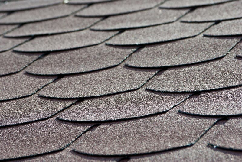 Grey roof tiles overlapping. Closeup. Grey roof tiles overlapping. Closeup.