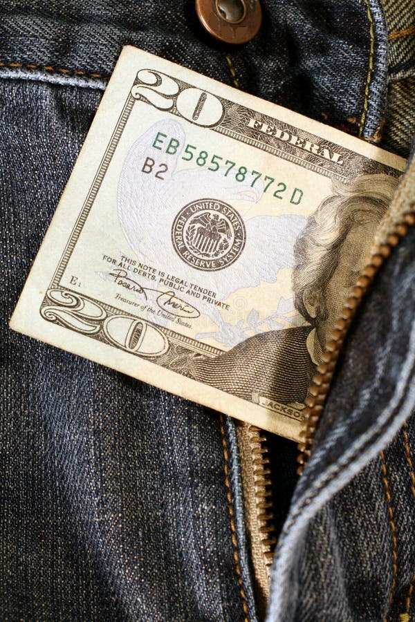 Twenty dollar bill coming out of pants zipper. Twenty dollar bill coming out of pants zipper.