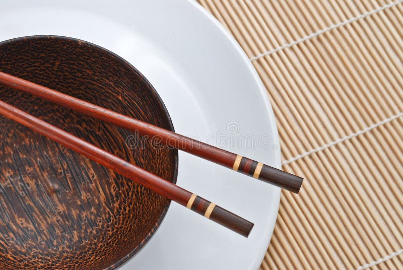 Bowl made of coconut palm tree with chopsticks. Bowl made of coconut palm tree with chopsticks