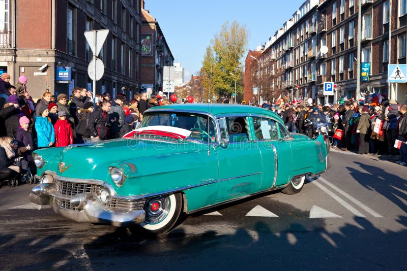 GDANSK, POLAND - NOVEMBER 11: The annual parade on the occasion of the Independence Day. March through the streets, and a demonstration of old cars, November 11, 2011 in Gdansk. GDANSK, POLAND - NOVEMBER 11: The annual parade on the occasion of the Independence Day. March through the streets, and a demonstration of old cars, November 11, 2011 in Gdansk.