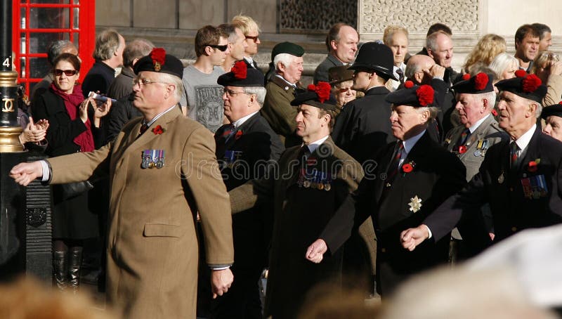 London, UK - November 13, 2011: People take part in Remembrance Day, Poppy Day or Armistice Day, 11 every Nov, observed by Commonwealth of Nations, to remember armed forces who have died since First World War, Parade. London, UK - November 13, 2011: People take part in Remembrance Day, Poppy Day or Armistice Day, 11 every Nov, observed by Commonwealth of Nations, to remember armed forces who have died since First World War, Parade.