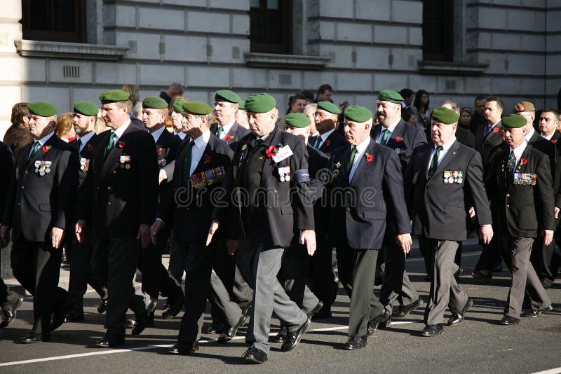 London, UK - November 13, 2011: People take part in Remembrance Day, Poppy Day or Armistice Day, 11 every Nov, observed by Commonwealth of Nations, to remember armed forces who have died since First World War, Parade. London, UK - November 13, 2011: People take part in Remembrance Day, Poppy Day or Armistice Day, 11 every Nov, observed by Commonwealth of Nations, to remember armed forces who have died since First World War, Parade.