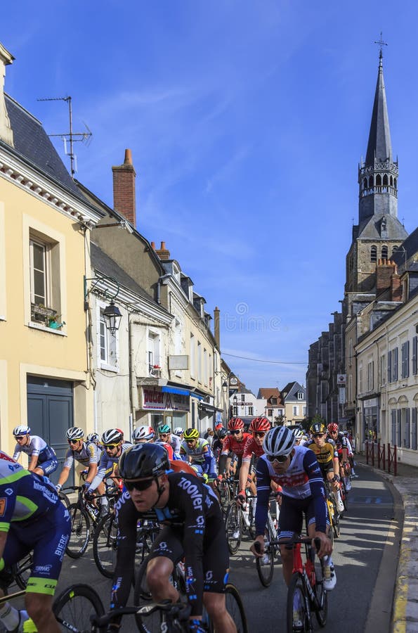 Bonneval, France - October 10, 2021: The peloton riding in Bonneval during road cycling race Paris-Tour 2021. Bonneval, France - October 10, 2021: The peloton riding in Bonneval during road cycling race Paris-Tour 2021