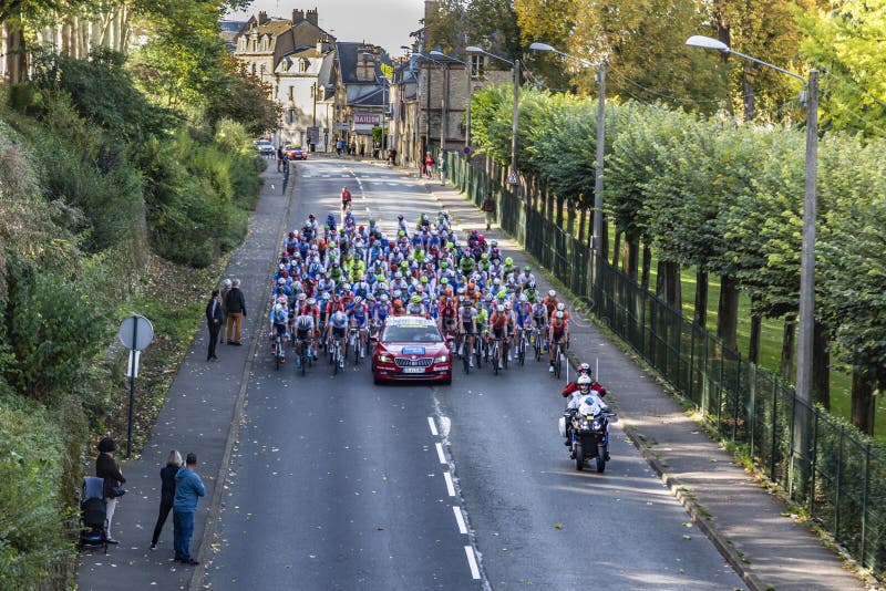 Chartres, France - October 13, 2019: Aerial view of the peloton riding in Chartres just before the real start of the autumn French cycling race Paris-Tours 2019. Chartres, France - October 13, 2019: Aerial view of the peloton riding in Chartres just before the real start of the autumn French cycling race Paris-Tours 2019