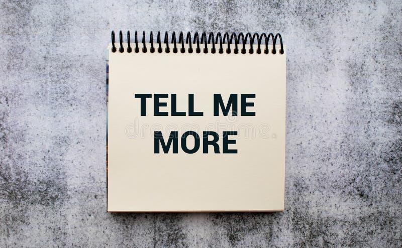 Tell me more symbol. Concept words Tell me more on wooden notebook. Beautiful wooden background. Business and Tell me more concept. Copy space. Tell me more symbol. Concept words Tell me more on wooden notebook. Beautiful wooden background. Business and Tell me more concept. Copy space.