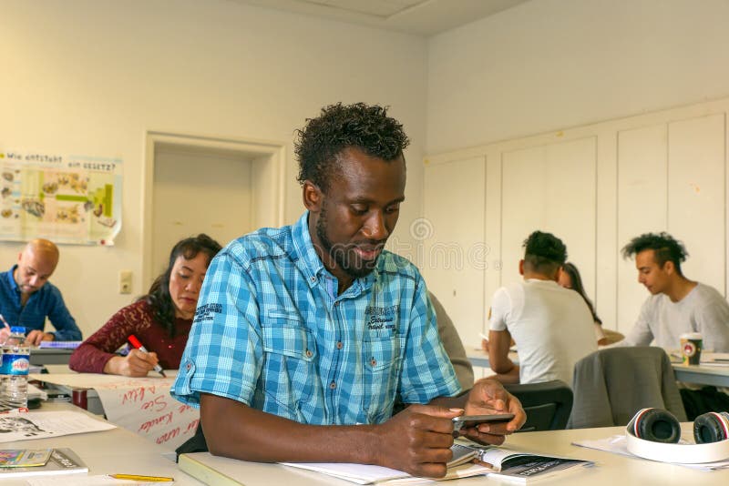 Migrants learn a foreign language in a European school, at integration courses. Europe, Germany, Halle Saale, 05/12/2017. Migrants learn a foreign language in a European school, at integration courses. Europe, Germany, Halle Saale, 05/12/2017