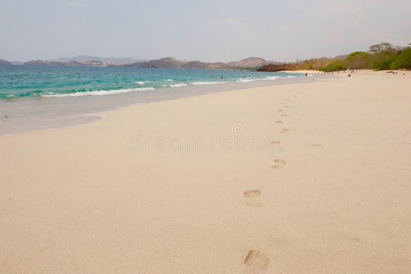 Footprints in the sand on the beach in Costa Rica. Footprints in the sand on the beach in Costa Rica.