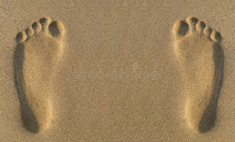 Two parallel footprints in sand. Two parallel footprints in sand