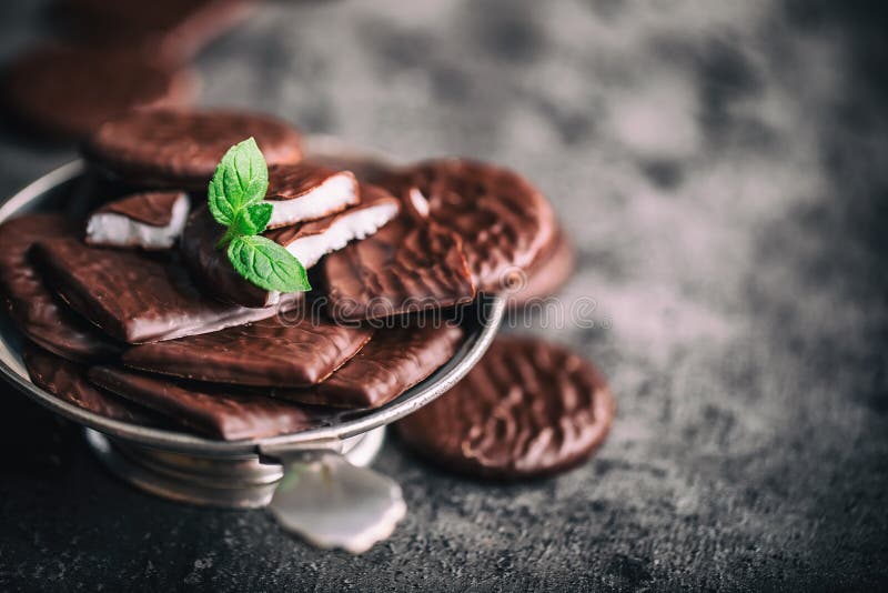 Chocolate peppermint cookies.Mint. Peppermint. Menthol. Black chocolate with peppermint cream. Black chocolate with mint stuffing. Menthol chocolate with mint leaves. Toned images. Chocolate peppermint cookies.Mint. Peppermint. Menthol. Black chocolate with peppermint cream. Black chocolate with mint stuffing. Menthol chocolate with mint leaves. Toned images.