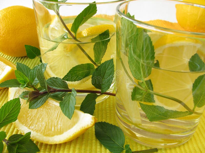 Lemonade drink with lemon and fresh peppermint. Lemonade drink with lemon and fresh peppermint