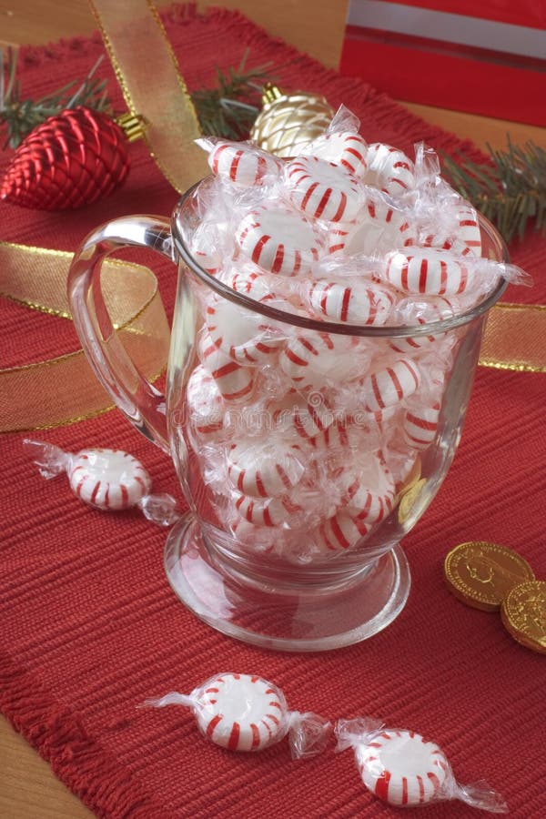 Cup filled with peppermint candy. Cup filled with peppermint candy.