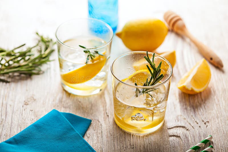 Rosemary lemonade summer cold cocktail drink. Rosemary lemonade summer cold cocktail drink