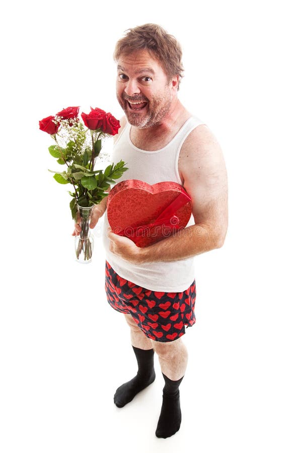 Scruffy middle aged man in his underwear with Valentines Day flowers and chocolates for his sweetheart. Isolated on White. Scruffy middle aged man in his underwear with Valentines Day flowers and chocolates for his sweetheart. Isolated on White