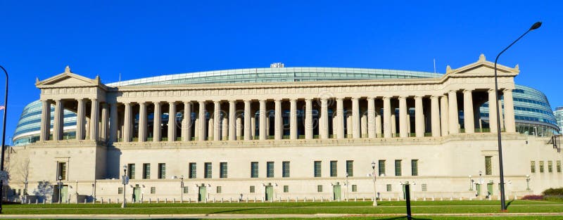 This is a picture of Soldier Field in Chicago, Illinois. The stadium was designed by the Architects Holabird & Roche. The stadium opened on October 9, 1924. In 2002 the stadium interior was gutted and a new stadium interior was built. The exterior Doric Columns highlighted the exterior design. On February 17, 2006 the stadium lost its designation as a National Historic Landmark designation as a result of the renovation. This picture was taken on November 2, 2014. This is a picture of Soldier Field in Chicago, Illinois. The stadium was designed by the Architects Holabird & Roche. The stadium opened on October 9, 1924. In 2002 the stadium interior was gutted and a new stadium interior was built. The exterior Doric Columns highlighted the exterior design. On February 17, 2006 the stadium lost its designation as a National Historic Landmark designation as a result of the renovation. This picture was taken on November 2, 2014