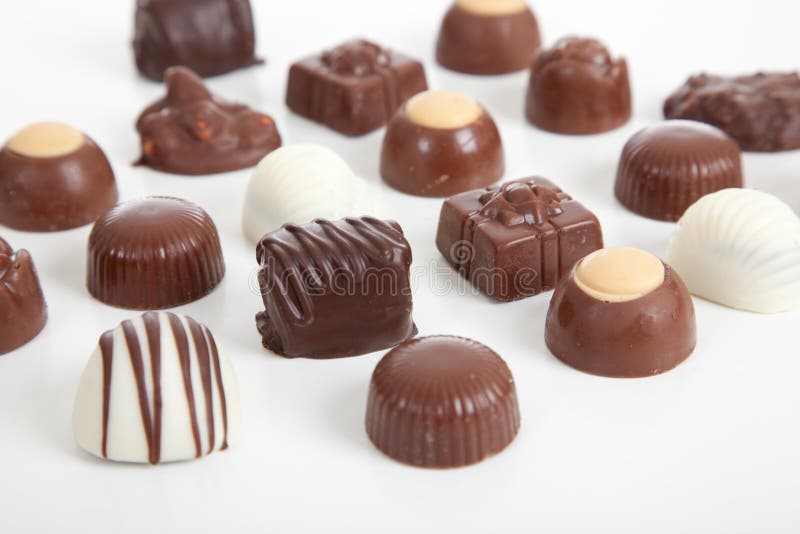 An assortment of gift chocolate candies on a white background. An assortment of gift chocolate candies on a white background