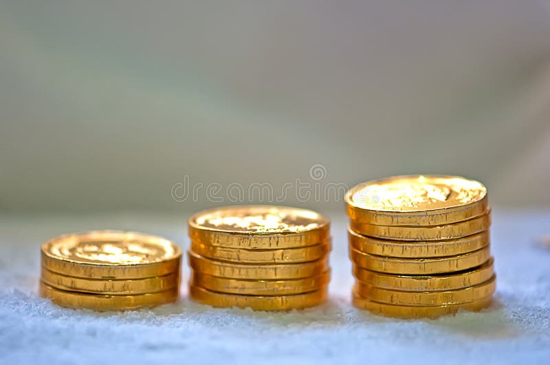 Closeup of a rising heaps of gold coins depicting increasing bar graph. Closeup of a rising heaps of gold coins depicting increasing bar graph