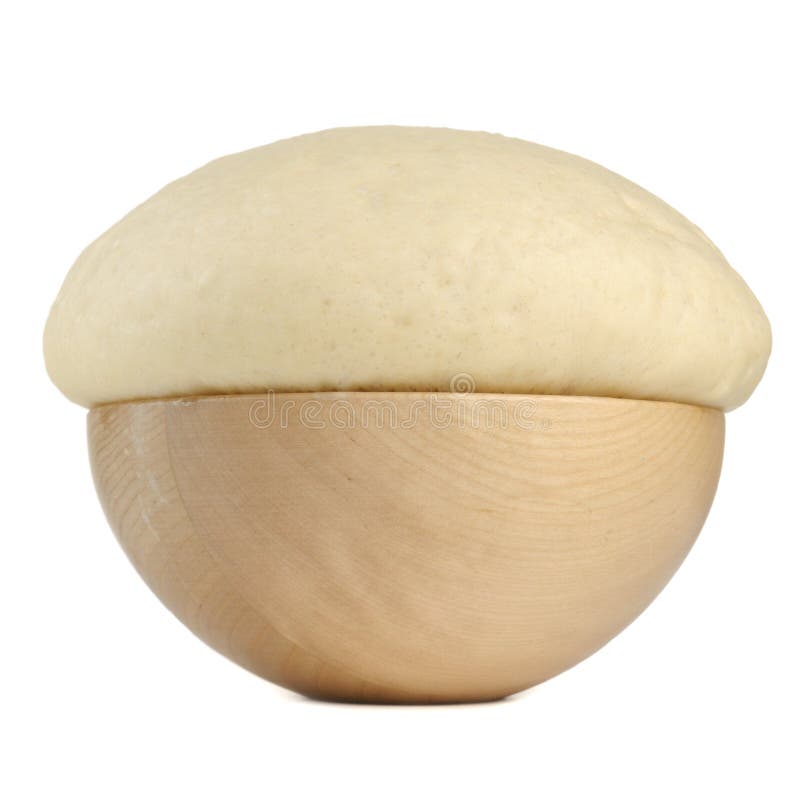 Rising yeast dough in a wooden bowl on a white background â€“ square image. Rising yeast dough in a wooden bowl on a white background â€“ square image