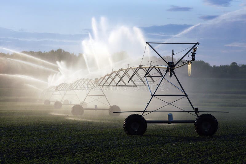 Crop irrigation system spraying a field. Crop irrigation system spraying a field