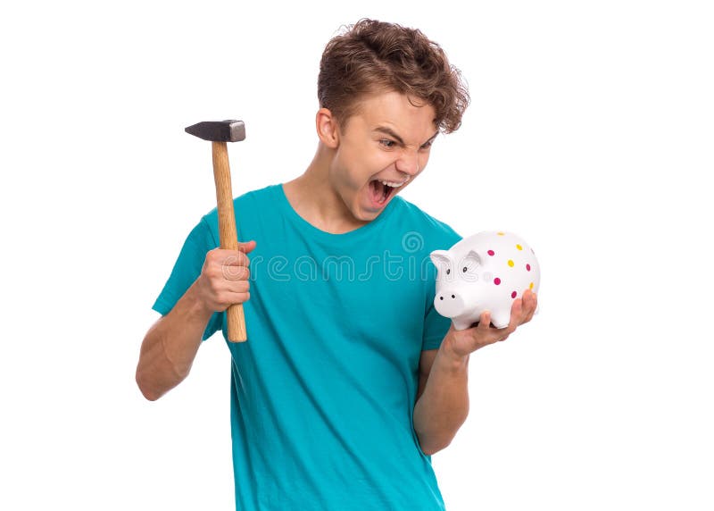 Portrait of teen boy holding Piggy Bank and Hammer. Cute caucasian young teenager isolated on white background. Saving Money concept. Crazy funny child about to break his piggybank. Portrait of teen boy holding Piggy Bank and Hammer. Cute caucasian young teenager isolated on white background. Saving Money concept. Crazy funny child about to break his piggybank