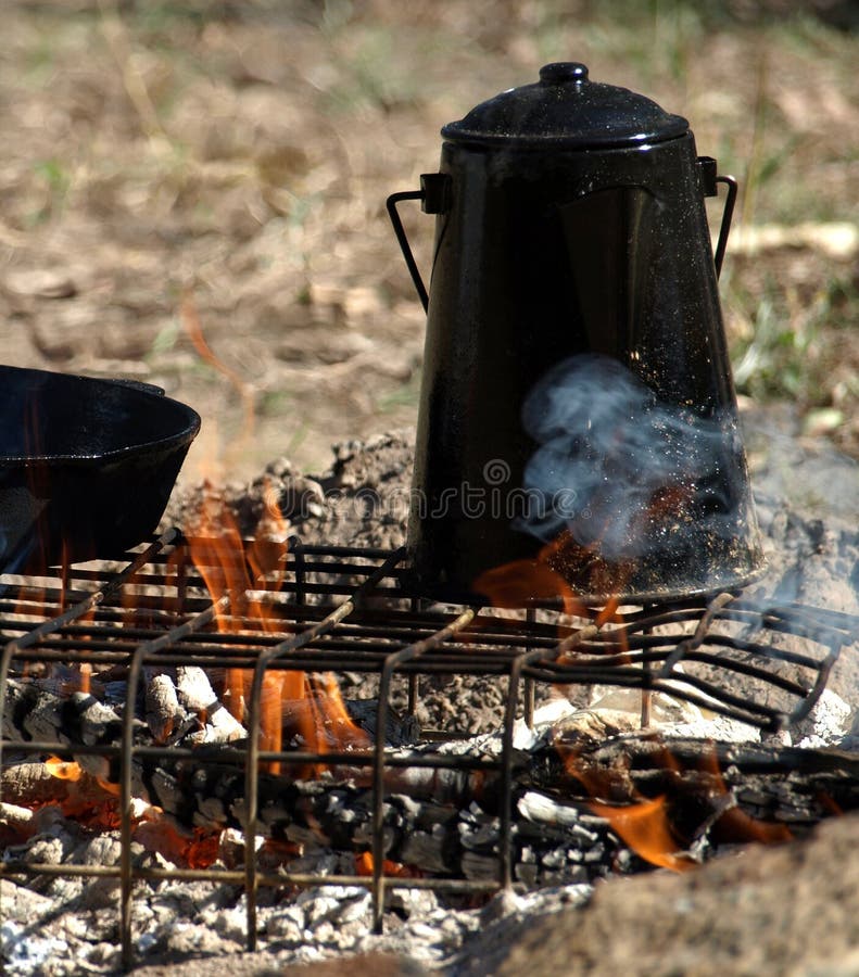 Billy boils on the campfire to make billy tea. Billy boils on the campfire to make billy tea