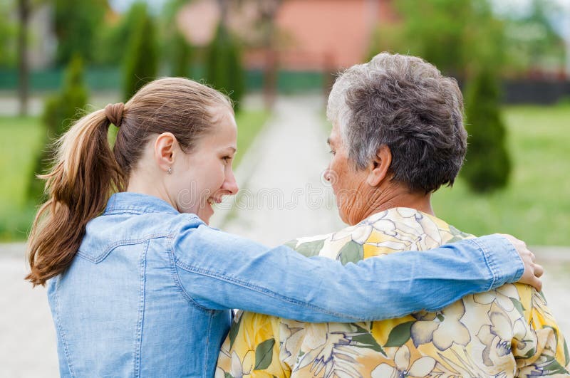 Elderly women tell her complaints to the carer. Elderly women tell her complaints to the carer