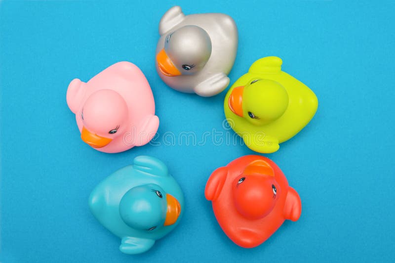 Five ducks plastic multi-colored watched from above. Five ducks plastic multi-colored watched from above