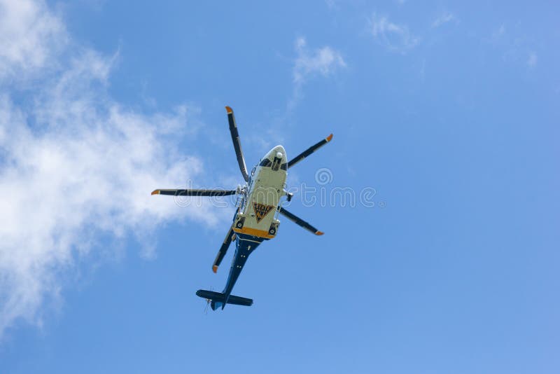 WOODBRIDGE, NEW JERSEY - June 1, 2020: A New Jersey State Police helicopter circles the area during late spring. WOODBRIDGE, NEW JERSEY - June 1, 2020: A New Jersey State Police helicopter circles the area during late spring