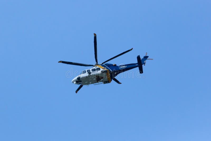 WOODBRIDGE, NEW JERSEY - June 1, 2020: A New Jersey State Police helicopter circles the area during late spring. WOODBRIDGE, NEW JERSEY - June 1, 2020: A New Jersey State Police helicopter circles the area during late spring